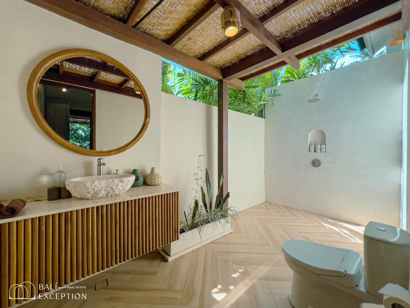 Modern bathroom with outdoor shower and wood accents.